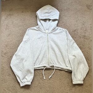 H&M women’s cropped gray zip up hoodie in a size medium.